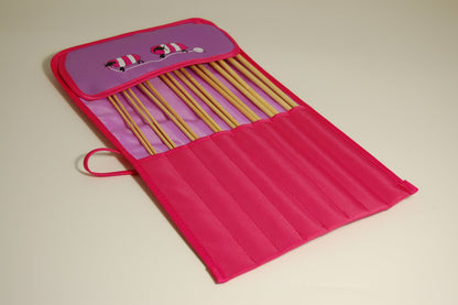 Knitting pins - 8 prs bamboo knitting needles in purple fabric case showing cartoon sheep