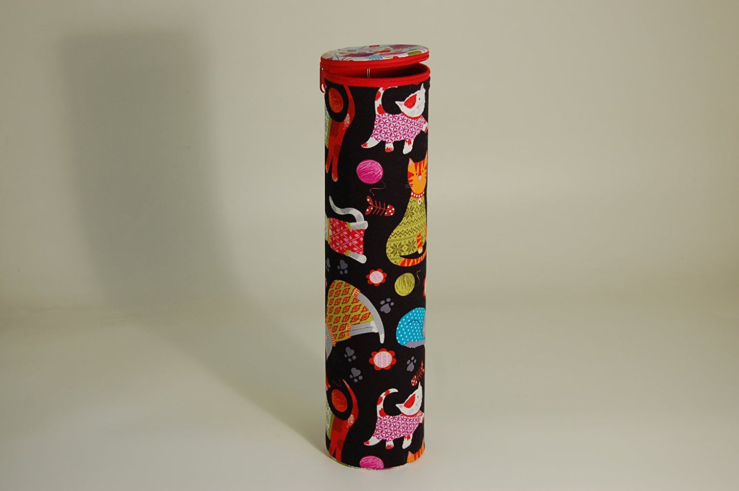 Knitting Pin holder - cylinder shape tube - fabric shows cartoon cats design on a dark background - hanrattycraftsgifts.co.uk